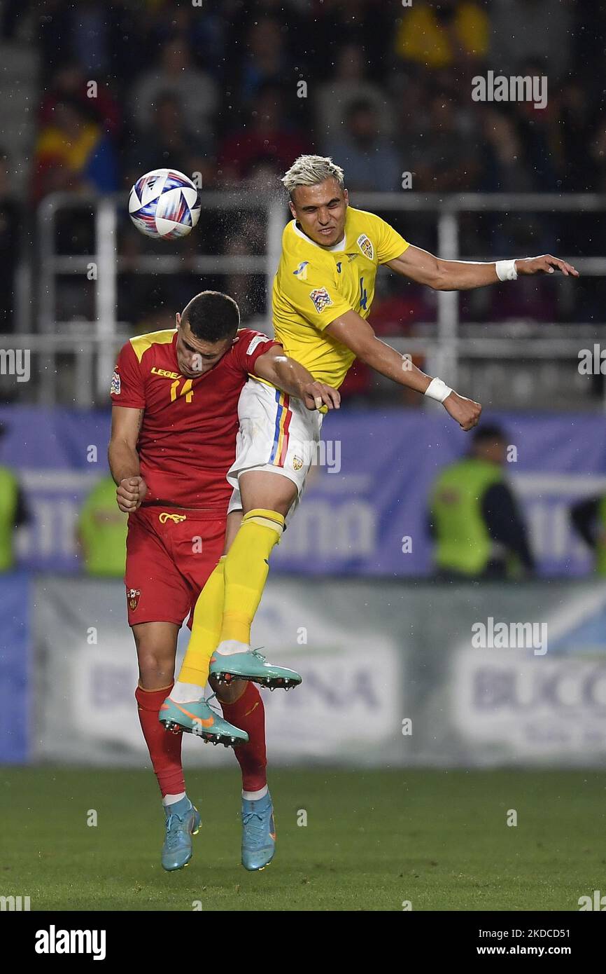 Cristian Manea and Nikola Krstovic in action during the UEFA Nations League -League B Group 3 match between Romania and Montenegro at Rapid Giulesti Stadium on June 14, 2022 in Bucharest, Romania. (Photo by Alex Nicodim/NurPhoto) Stock Photo