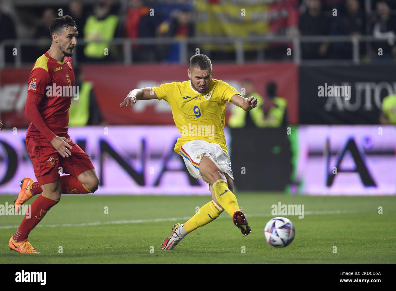 George Puscas and Zarko Tomasevic in action during the UEFA Nations League -League B Group 3 match between Romania and Montenegro at Rapid Giulesti Stadium on June 14, 2022 in Bucharest, Romania. (Photo by Alex Nicodim/NurPhoto) Stock Photo