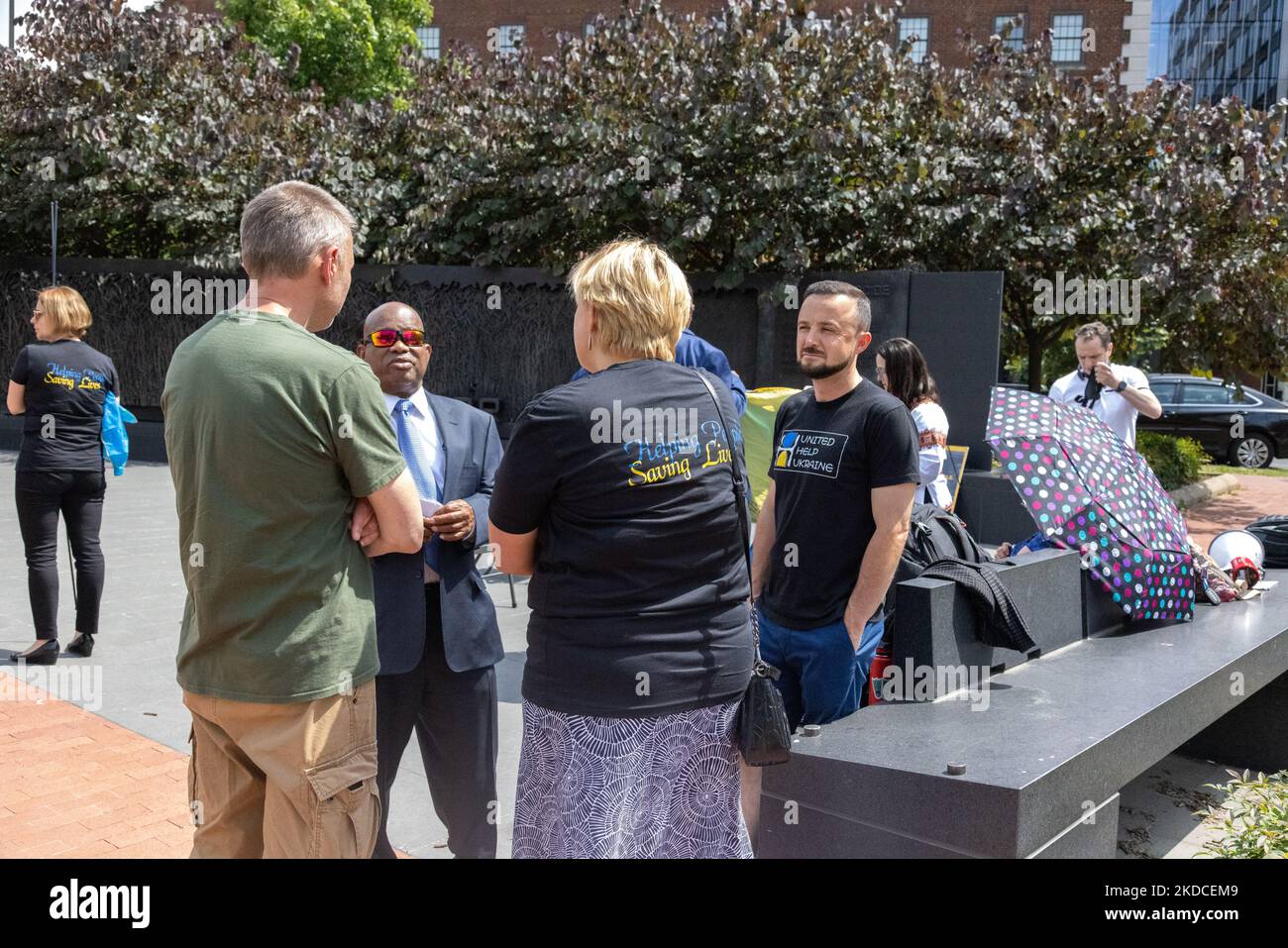 Workers with United Help Ukraine attend a ceremony at the Holodomor Memorial in Washington, D.C. on June 21, 2022, announcing the donation of a re-purposed truck-mounted mobile medical clinic for rapid deployment to Ukraine. (Photo by Bryan Olin Dozier/NurPhoto) Stock Photo