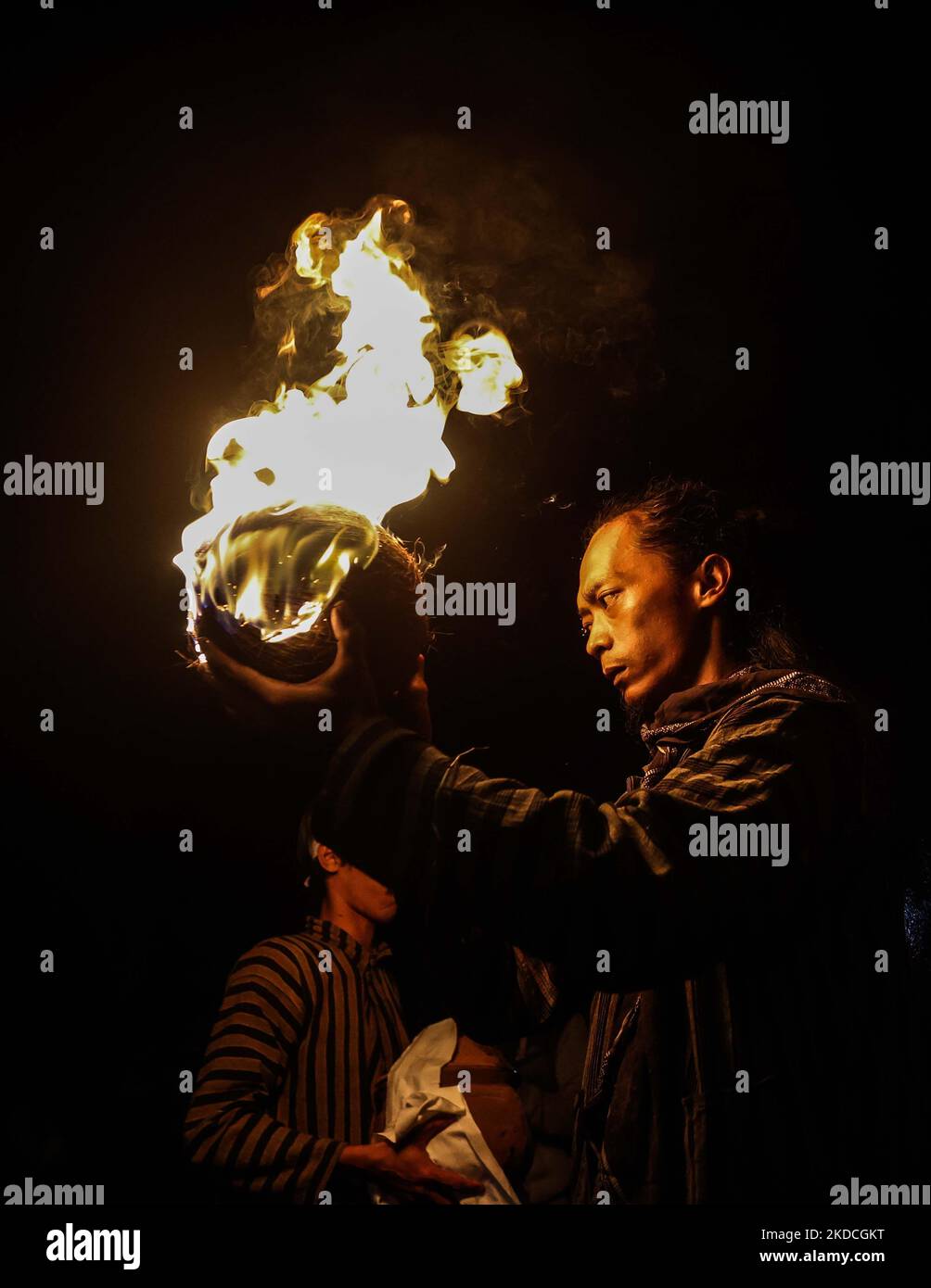 Villagers leaders prepare a ritual prior to playing fire football ...