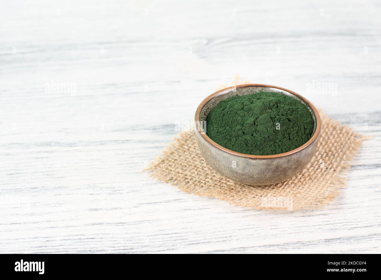 Spirulina algae powder in a bowl, alternative medicine for to detox