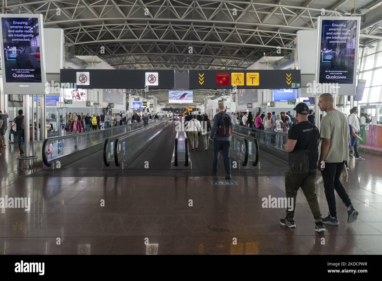 Morning departing and arriving passengers are seen carrying their