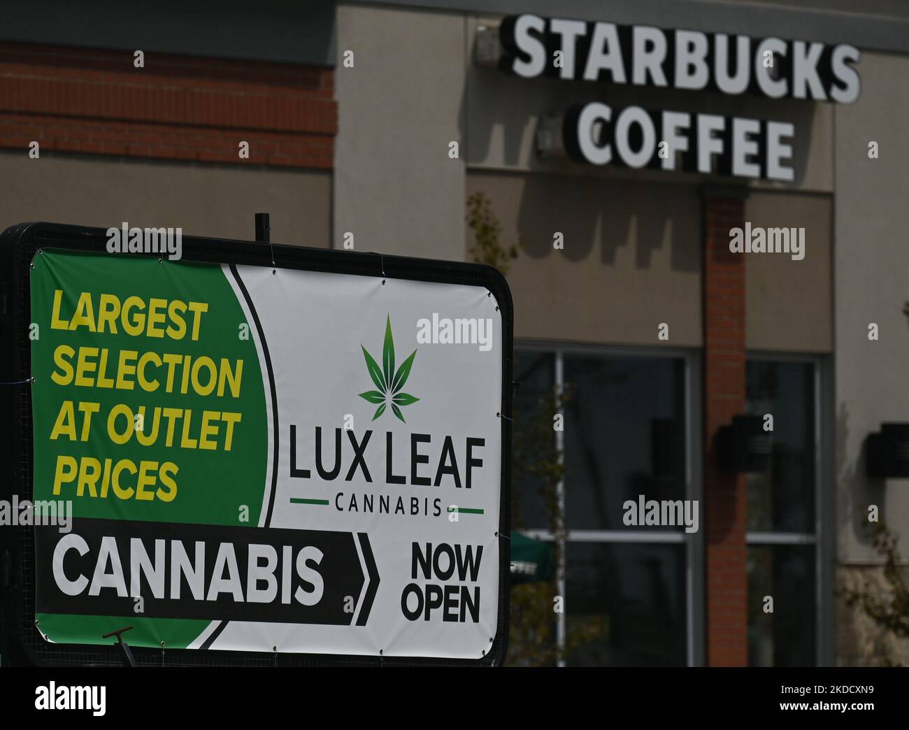 Lux Leaf Cannabis shop ad next to the Starbucks Coffee in South Edmonton Common. Friday, May 20, 2022, in Edmonton, Alberta, Canada. (Photo by Artur Widak/NurPhoto) Stock Photo