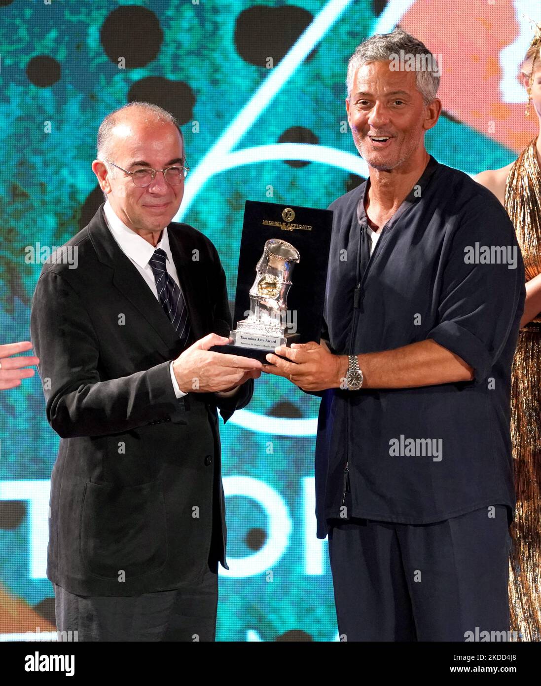 Rosario Fiorello and Giuseppe Tornatore on the stage of the Ancient Theater of Taormina. Final evening of the 68th edition of the Taormina Film Festival dedicated to the maestro Ennio Morricone. 68th Taorminafilmfest, Taormina (ME), Italy, on July 02, 2022 (Photo by Gabriele Maricchiolo/NurPhoto) Stock Photo