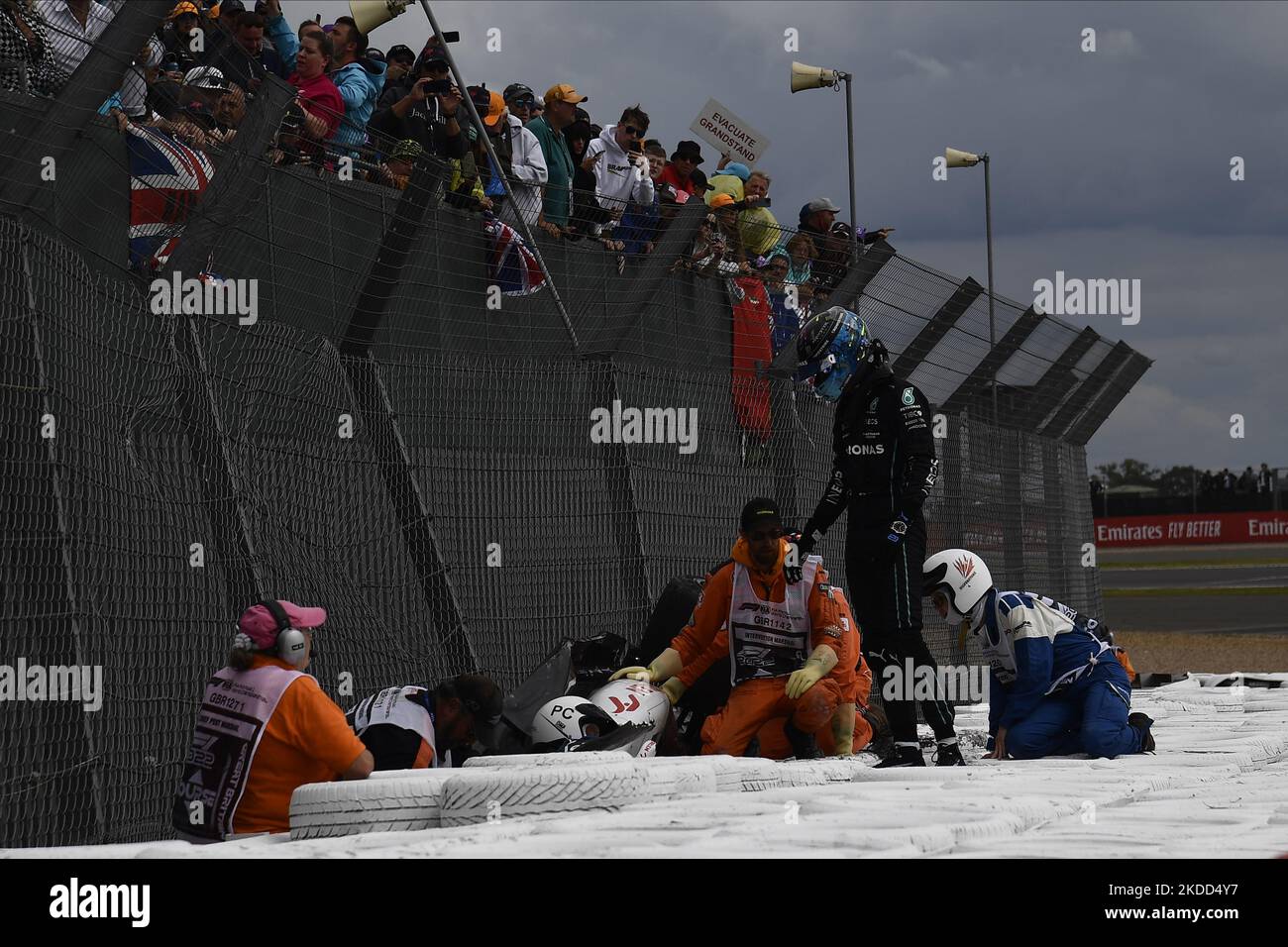 Zhou Guanyu of China Alfa Romeo F1 and George Russell of Great Britain and AMG Petronas F1 crash their cars during the race of the F1 Grand Prix of Great Britain at Silverstone on July 3, 2022 in Northampton, United Kingdom. (Photo by Jose Breton/Pics Action/NurPhoto) Stock Photo