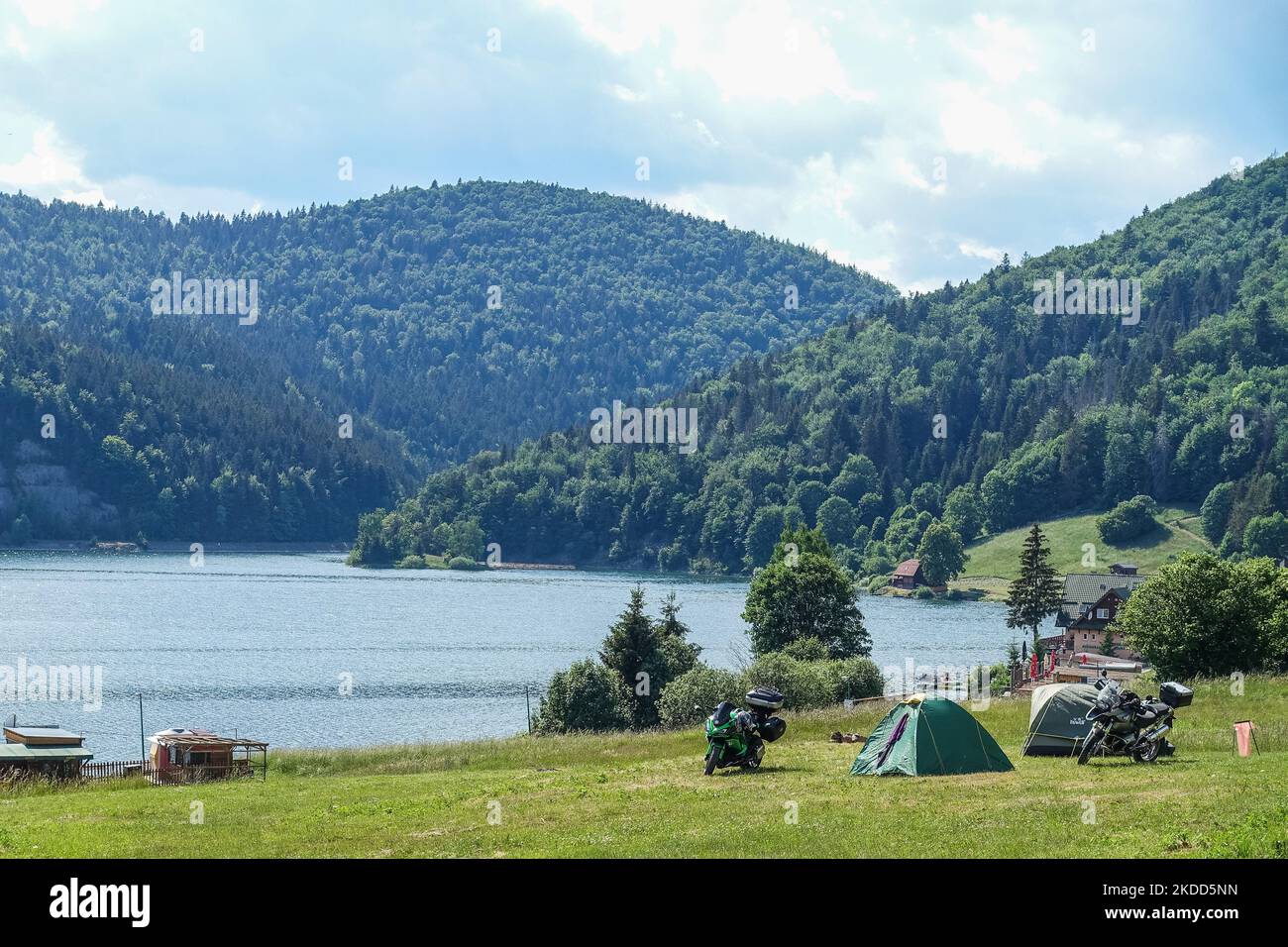 Tents set up on the hillside with a motorcycles in front of them are seen in Dedinky, Slovakia on 16 June 2022 (Photo by Michal Fludra/NurPhoto) Stock Photo