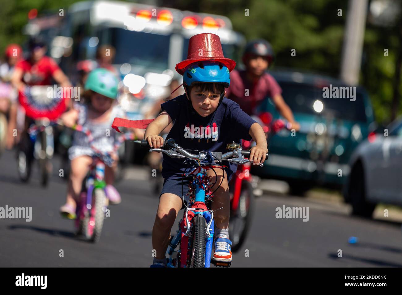 Children ride bicycles during an annual Fourth of July bicycle parade