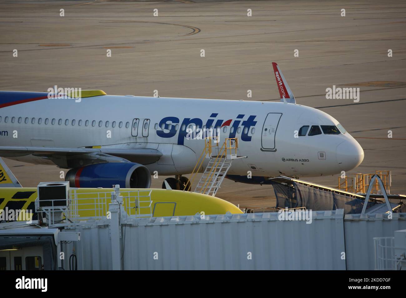 A Spirit Airlines plane, still painted with their old logo, can be seen at George Bush Intercontinental Airport in Houston, Texas on July 5th, 2022. (Photo by Reginald Mathalone/NurPhoto) Stock Photo