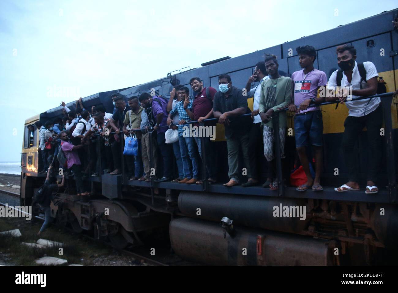 passengers-board-the-engine-compartment-of-an-overcrowded-train-in