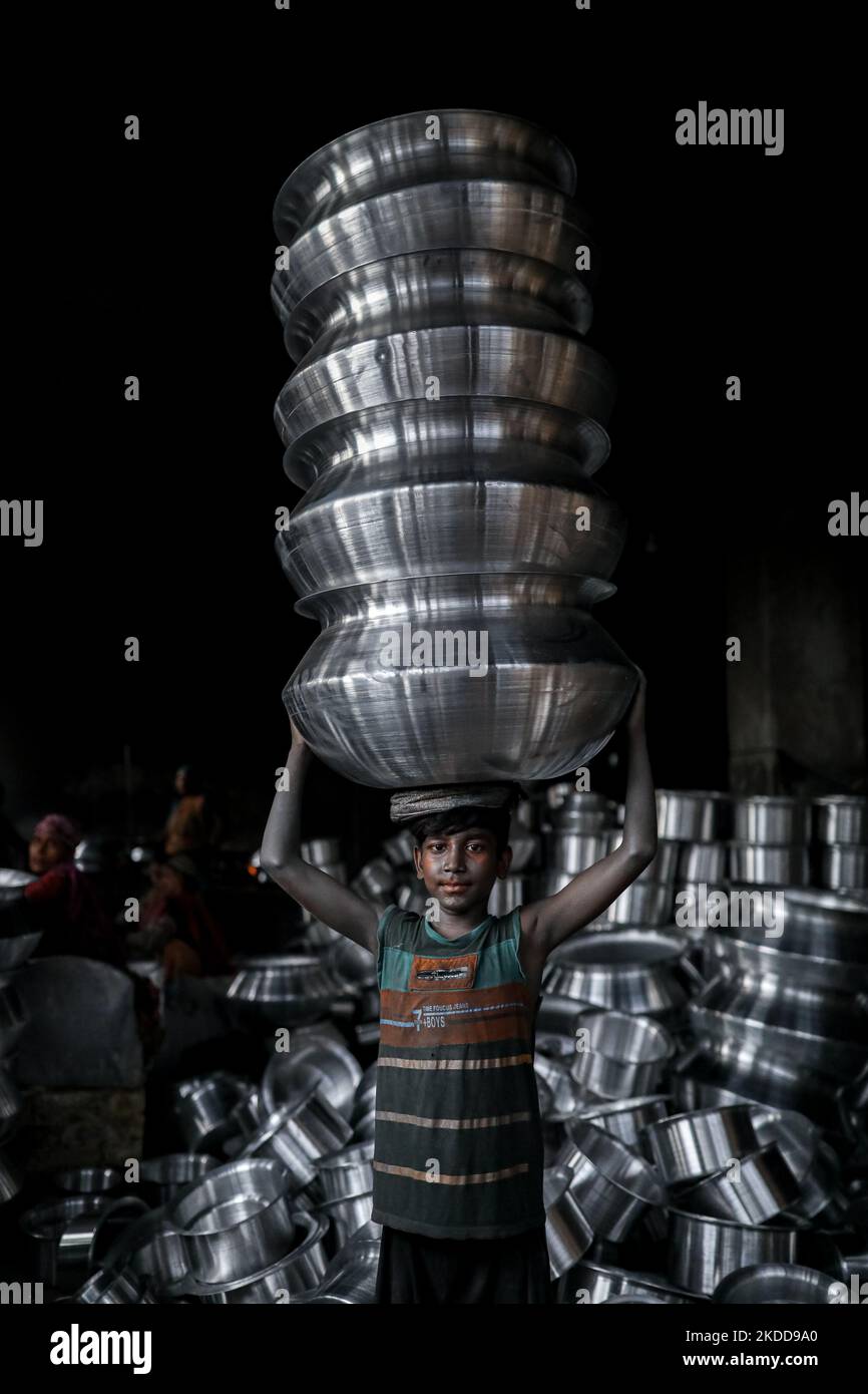 A child works inside a kitchen utensils factory at Shyampur in Dhaka, Bangladesh on July 4, 2022