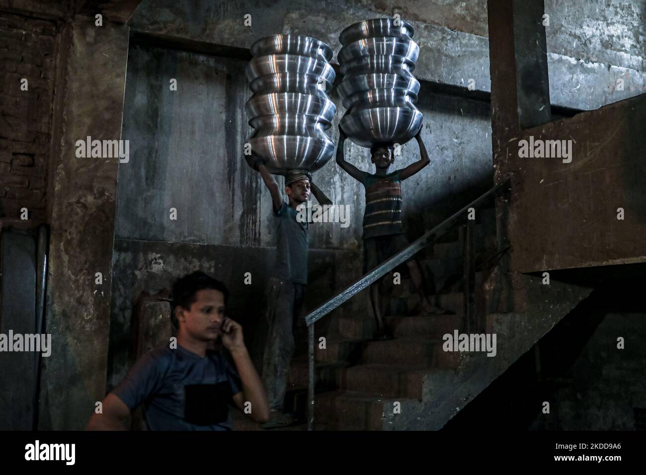A child works inside a kitchen utensils factory at Shyampur in Dhaka, Bangladesh on July 4, 2022