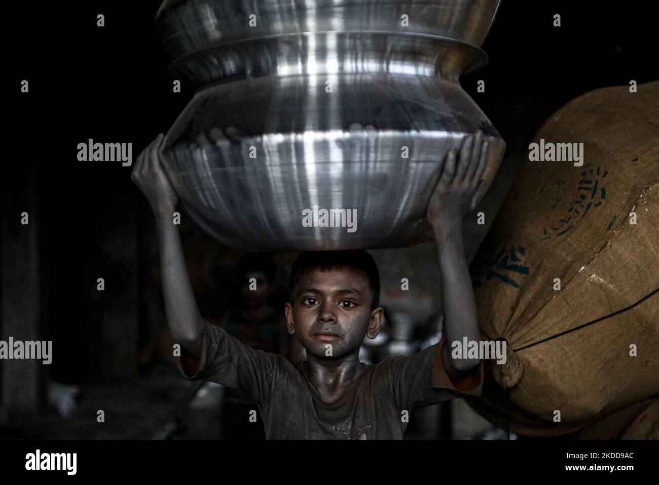 A child works inside a kitchen utensils factory at Shyampur in Dhaka, Bangladesh on July 4, 2022