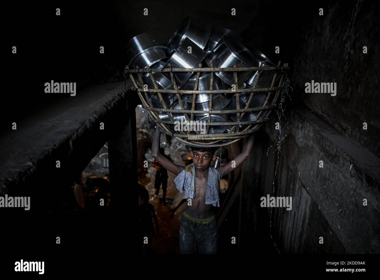 A child works inside a kitchen utensils factory at Shyampur in Dhaka, Bangladesh on July 4, 2022