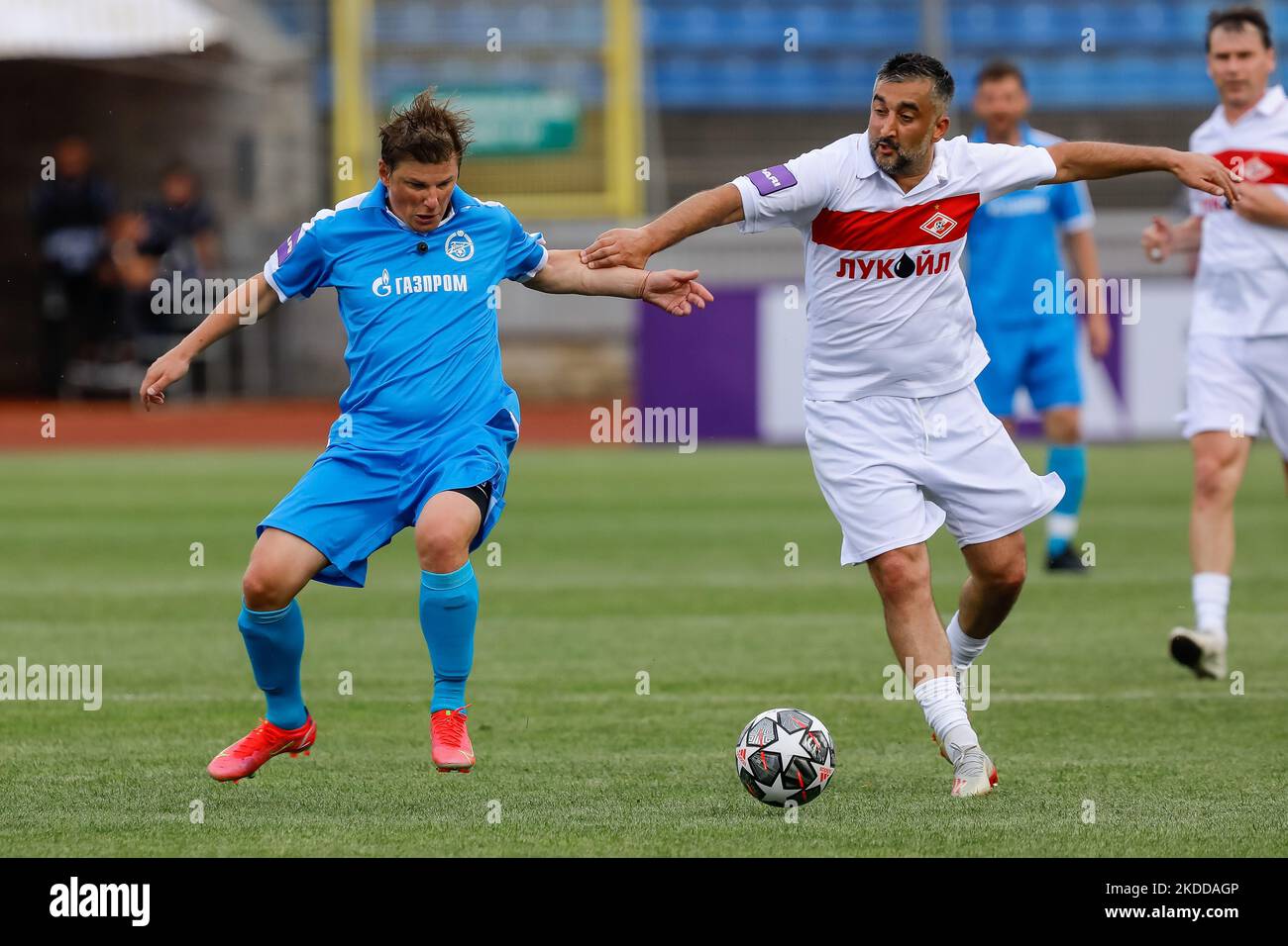 Zenit St. Petersburg football legend Andrey Arshavin (L) and Spartak Moscow football legend Aleksandr Samedov vie for the ball during the Match of Legends friendly match between Zenit St. Petersburg Legends team and Spartak Moscow Legends team on July 8, 2022 at Petrovsky Stadium in St. Petersburg, Russia. (Photo by Mike Kireev/NurPhoto) Stock Photo