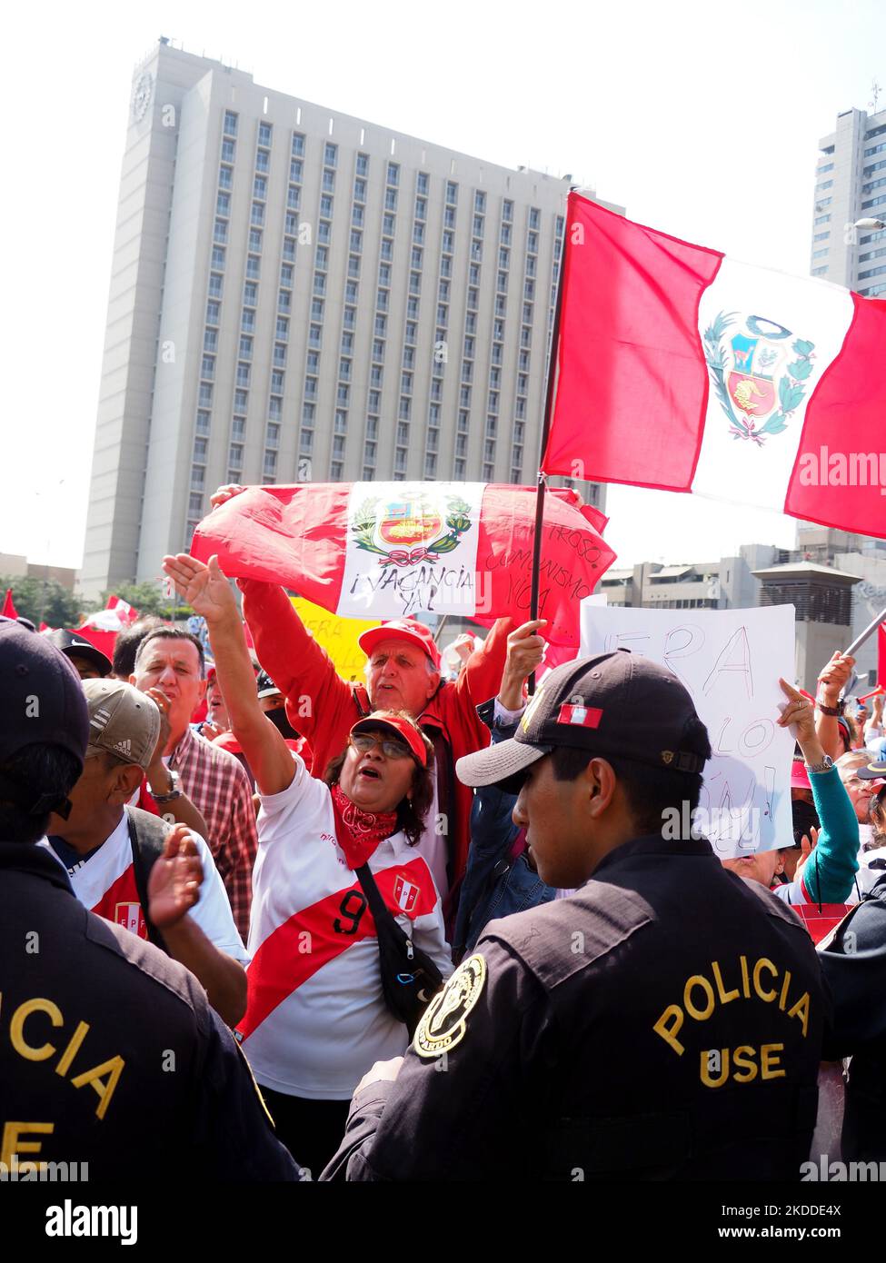 Demonstrators waving Peruvian flags when thousands of people take to the streets, once again, to protest against President Pedro Castillo. Castillo, who is immersed in several investigations for alleged acts of corruption in which his closest entourage would also be involved, has requested the intervention of the OAS in order to support his regime. Stock Photo