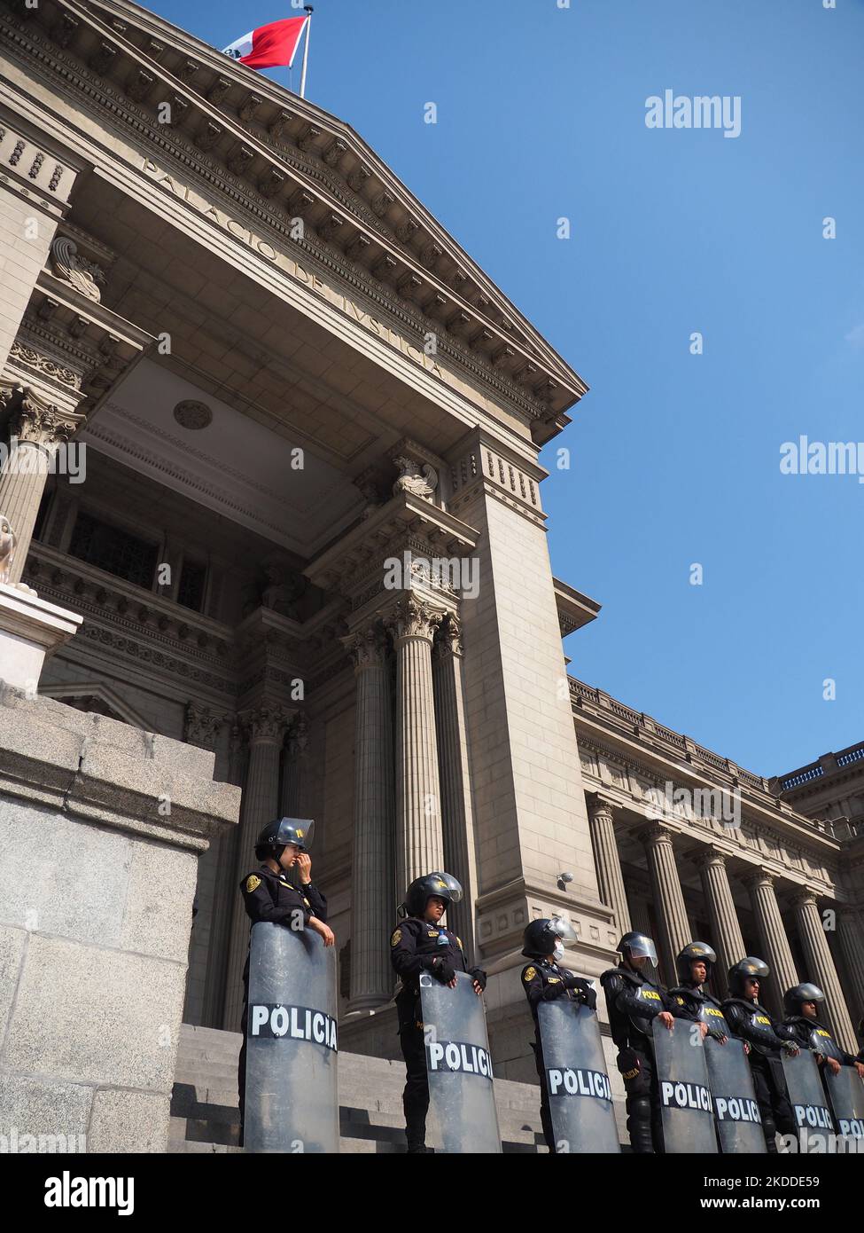 Police squad guarding the courthouse when thousands of people take to the streets, once again, to protest against President Pedro Castillo. Castillo, who is immersed in several investigations for alleged acts of corruption in which his closest entourage would also be involved, has requested the intervention of the OAS in order to support his regime. Stock Photo