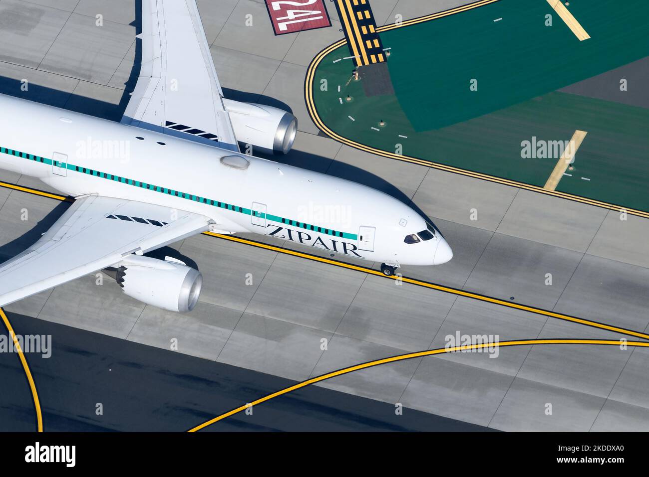 ZIPAIR Boeing 787 aircraft at an airport taxiway. Low-cost airline from Japan named Zipair that operates B787 Dreamliner airplane. Zip Air 787-8 plane Stock Photo