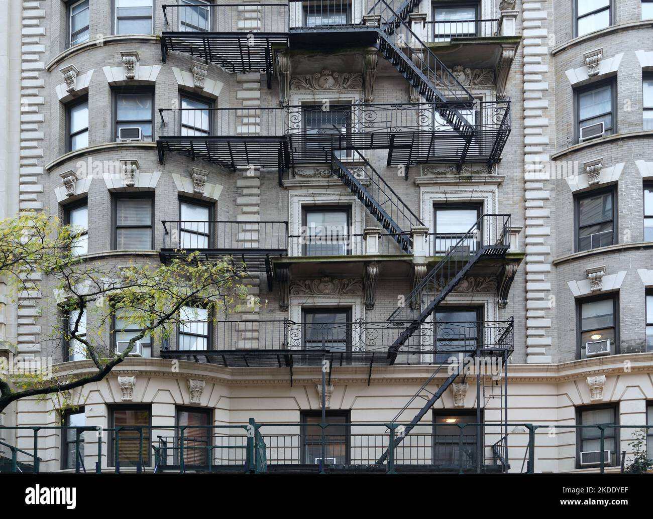 Ornate New York beaux-arts style old apartment building with external fire escape Stock Photo