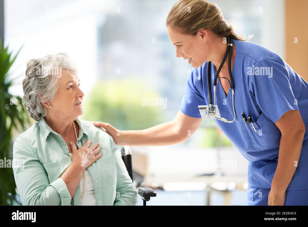 Rest assured...a female carer at a nursing home with her senior patient