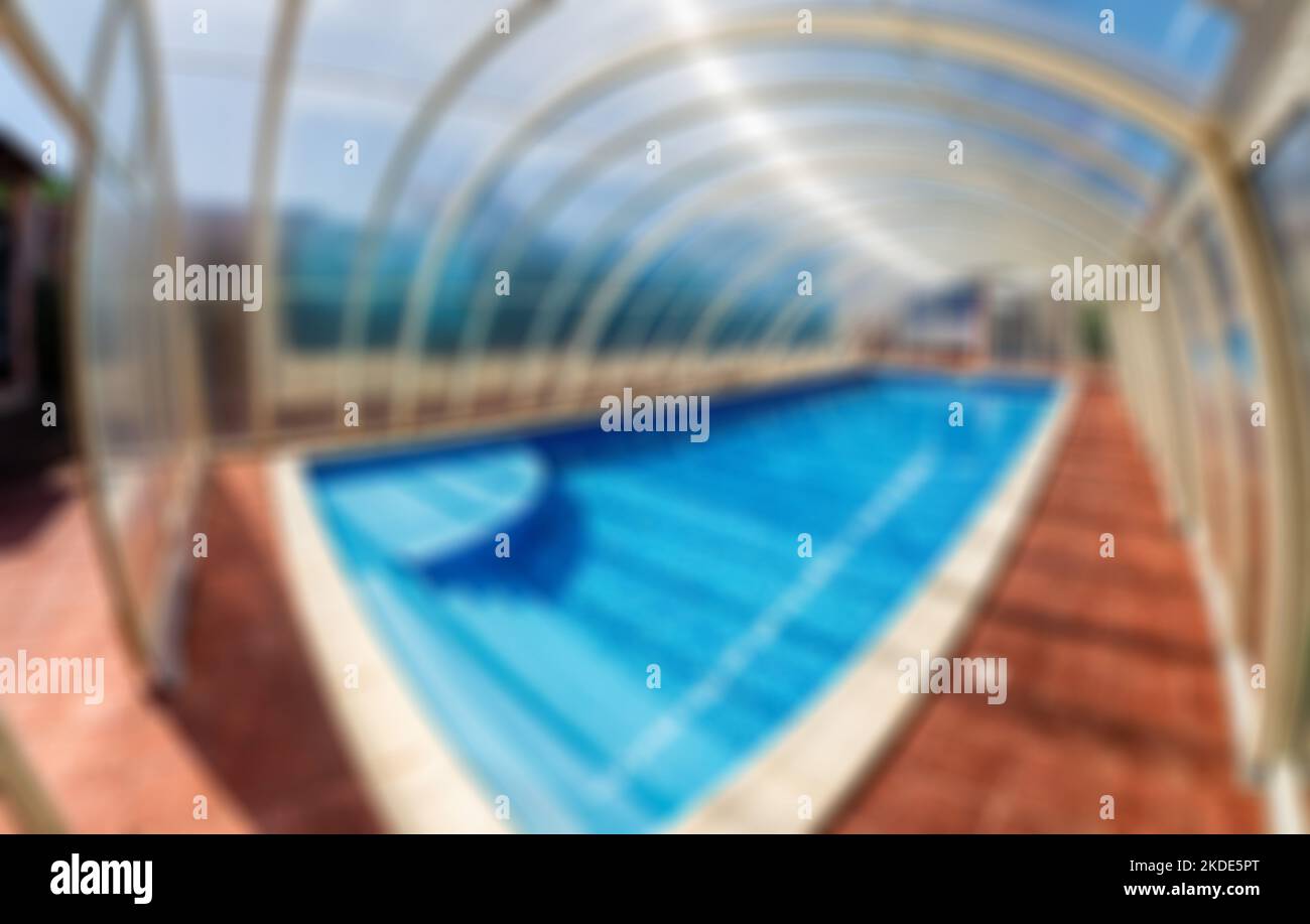 Abstract defocused blured background Covered summer pool. The covered ...