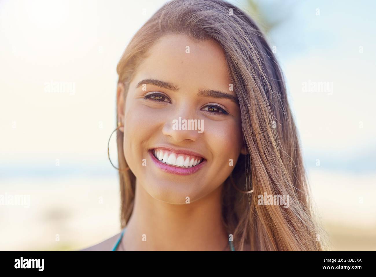 I live for summer. Portrait of an attractive young woman standing outside on a sunny day. Stock Photo