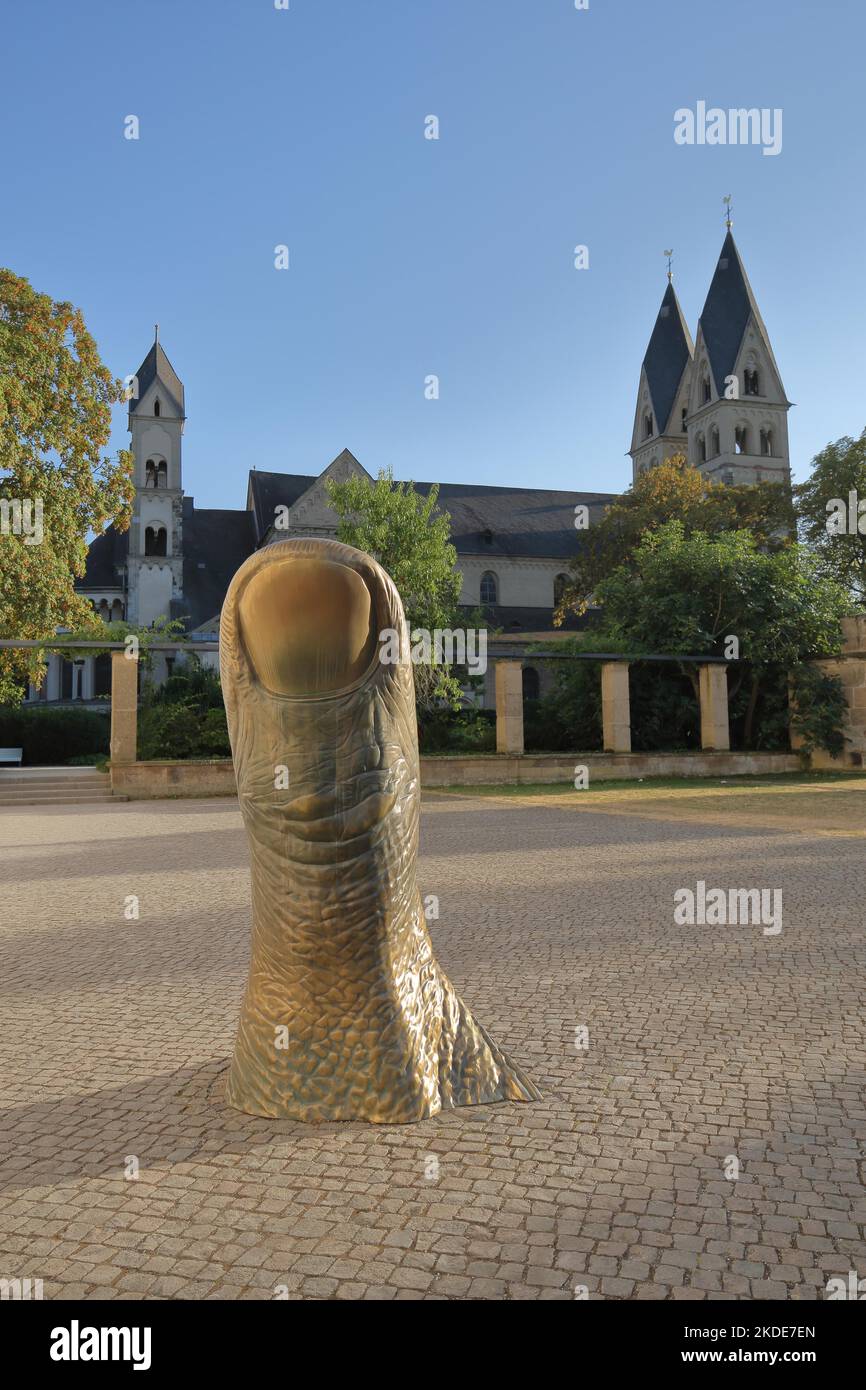 Sculpture The Thumb by Cesar Baldaccini 1993 and UNESCO Basilica St. Kastor in front of the Ludwig Museum, Deutschherrenhaus, oversize, finger Stock Photo