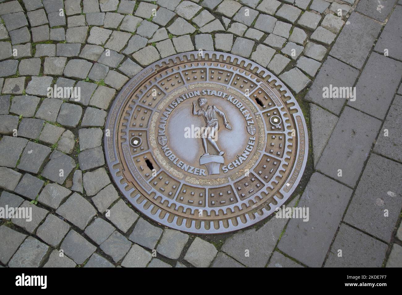 Manhole cover with landmark Schaengel and inscription, floor, paving ...