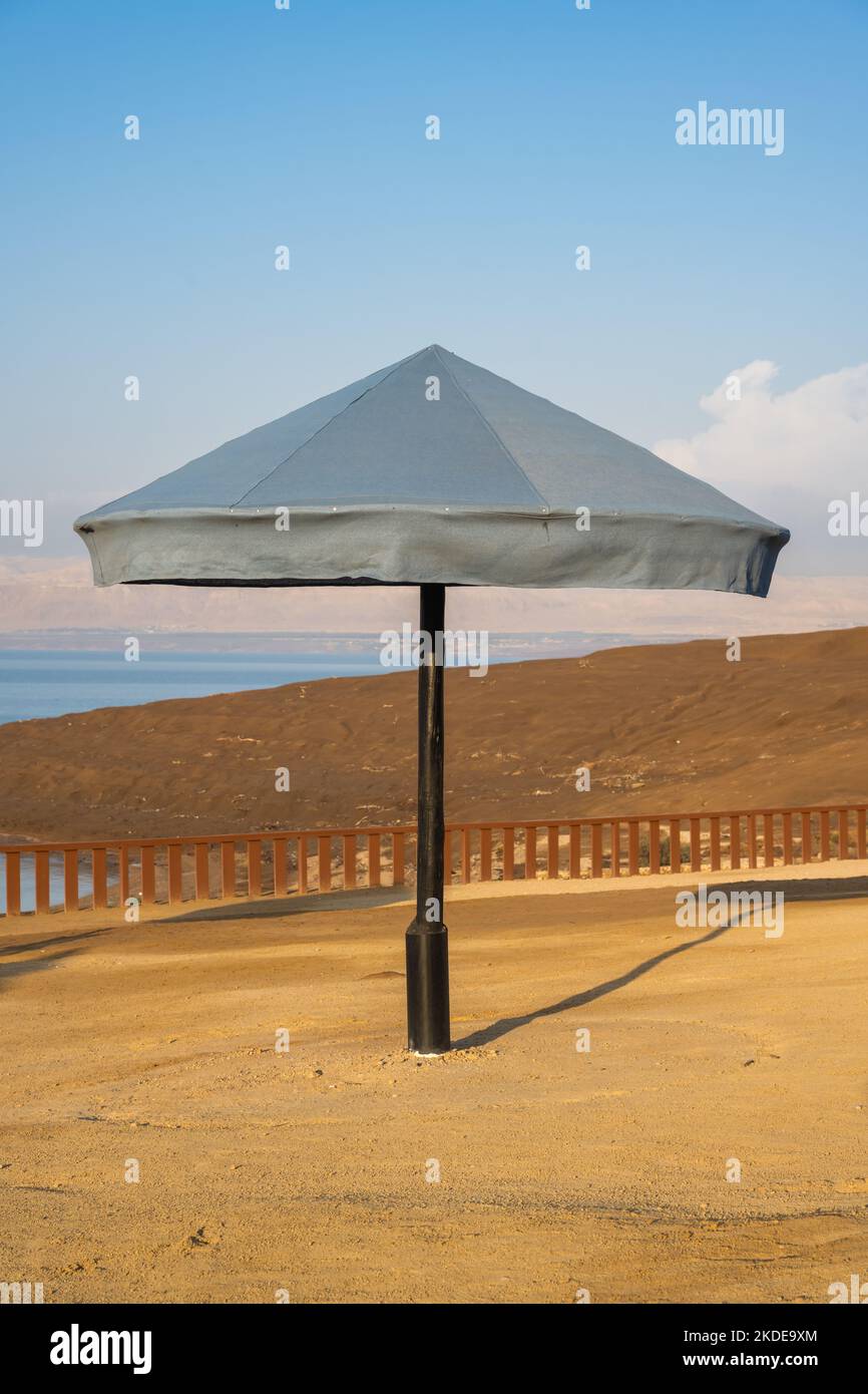 Beach Umbrella or Parasol at the Dead Sea Coast near Swemeh in Jordan Stock Photo