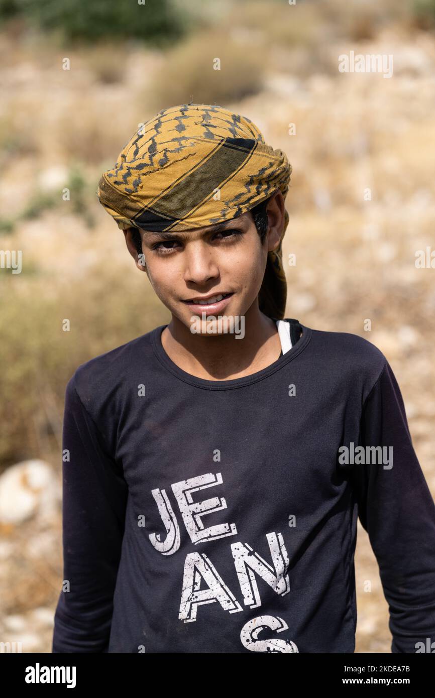 Mount Nebo, Madaba, Jordan - October 26 2022: Jordanian Shepherd Boy Wearing a Traditional Keffiyeh Headscarf Stock Photo