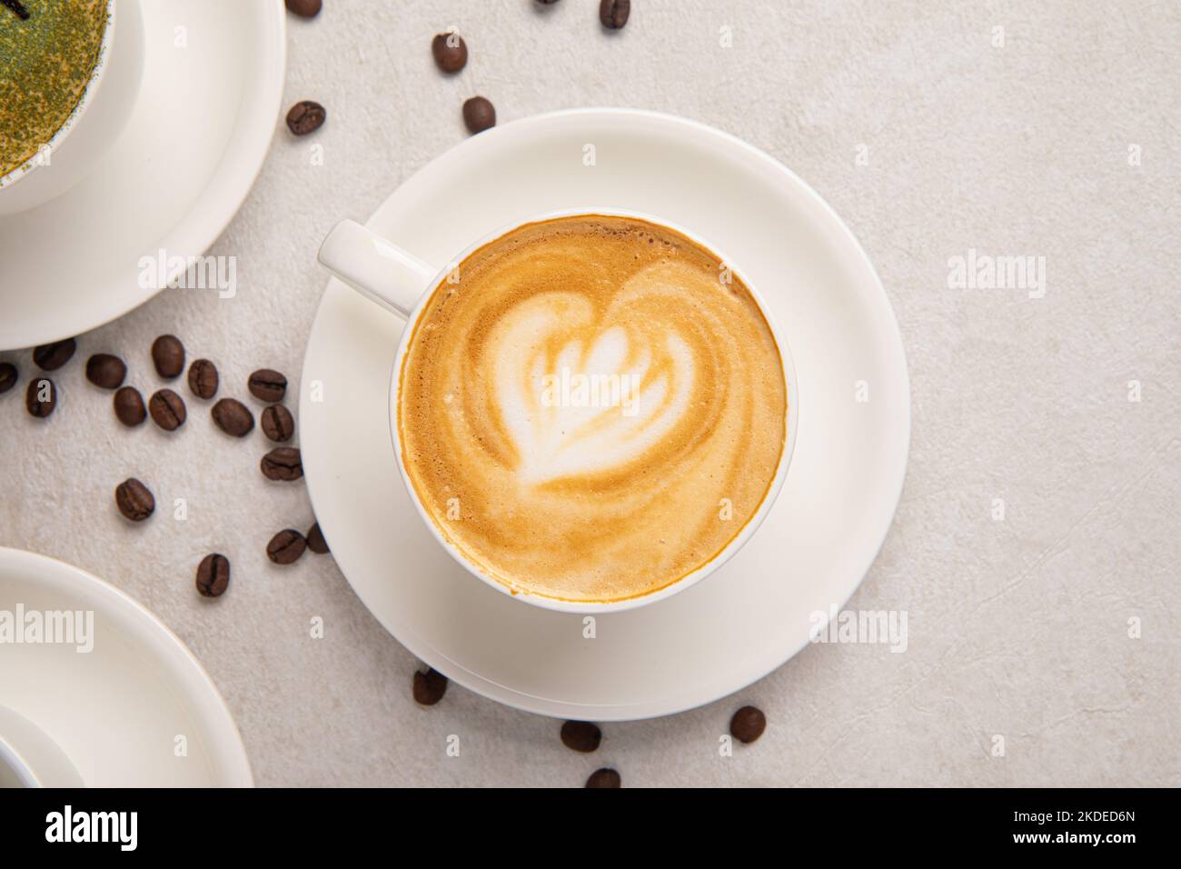 Cup of cappuccino coffee on the white table Stock Photo