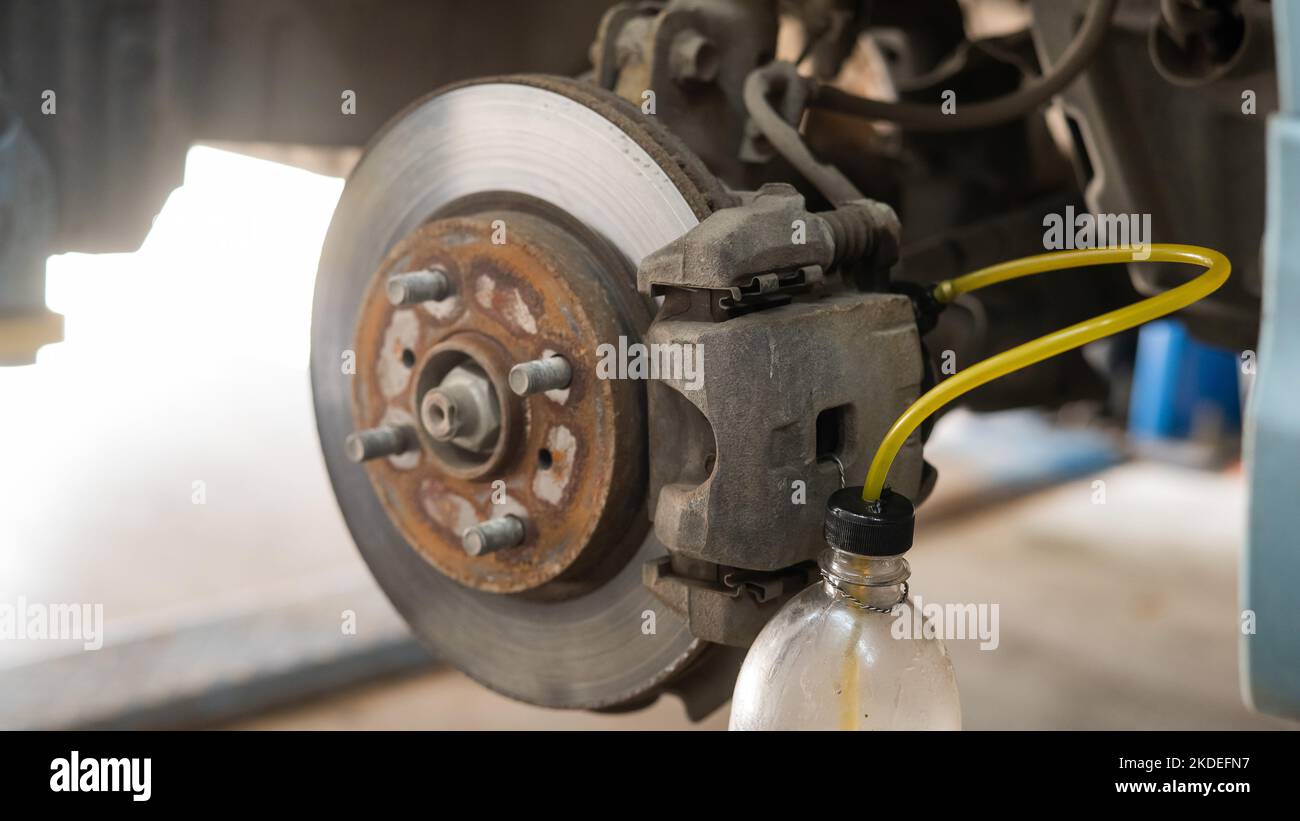 Automatic change of brake fluid in a car service Stock Photo Alamy
