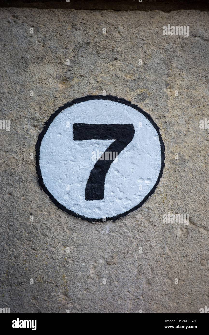 Number 7 house number on a stone wall Stock Photo Alamy