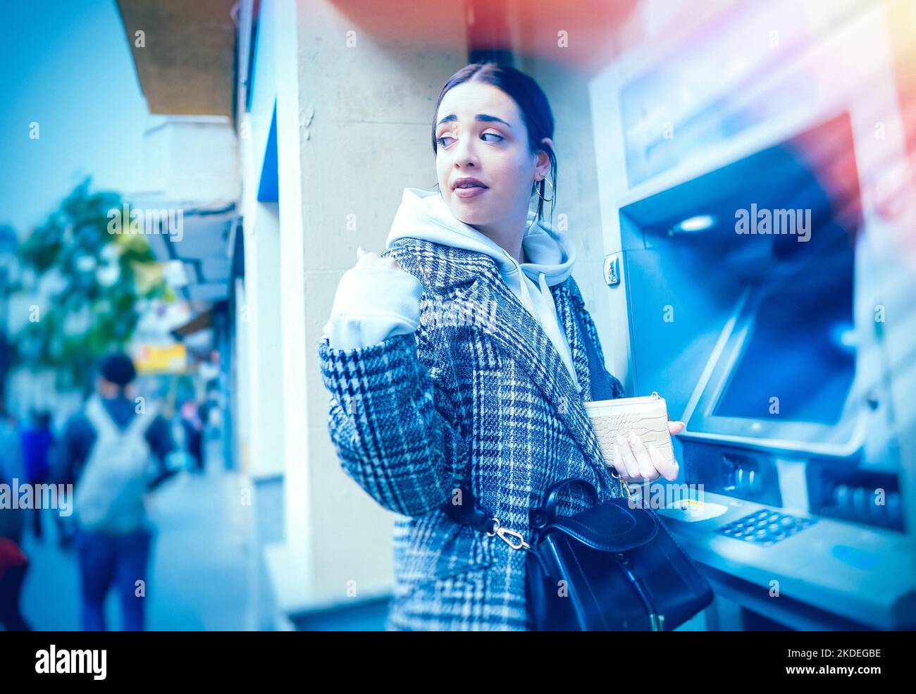 fear of being mugged at the ATM machine Stock Photo Alamy