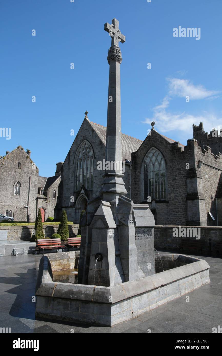 Fountain in front of Holy Trinity Abbey Church in Adare, County Limerick, Ireland Stock Photo