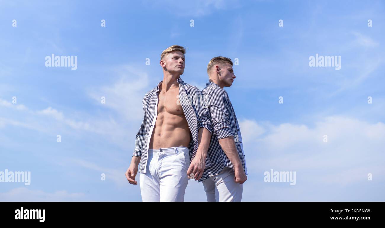 Men strong athlete wear same shirts. Brothers twins looks attractive ...
