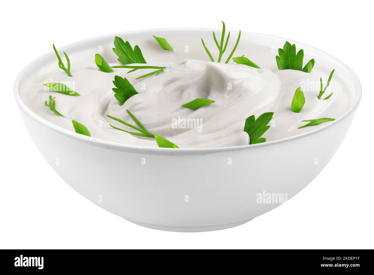 sour cream with onion, parsley, dill, herbs in bowl, isolated on white background, clipping path, full depth of field Stock Photo