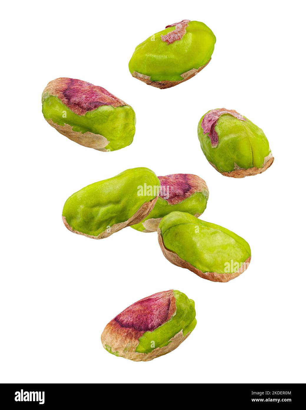 Falling pistachio peeled isolated on white background, clipping path, full depth of field Stock Photo