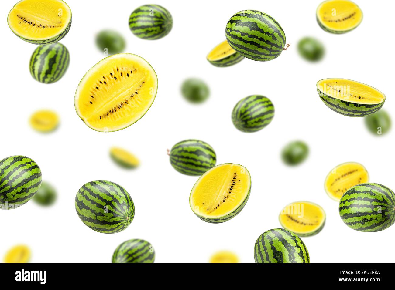 Falling yellow watermelon isolated on white background, selective focus Stock Photo