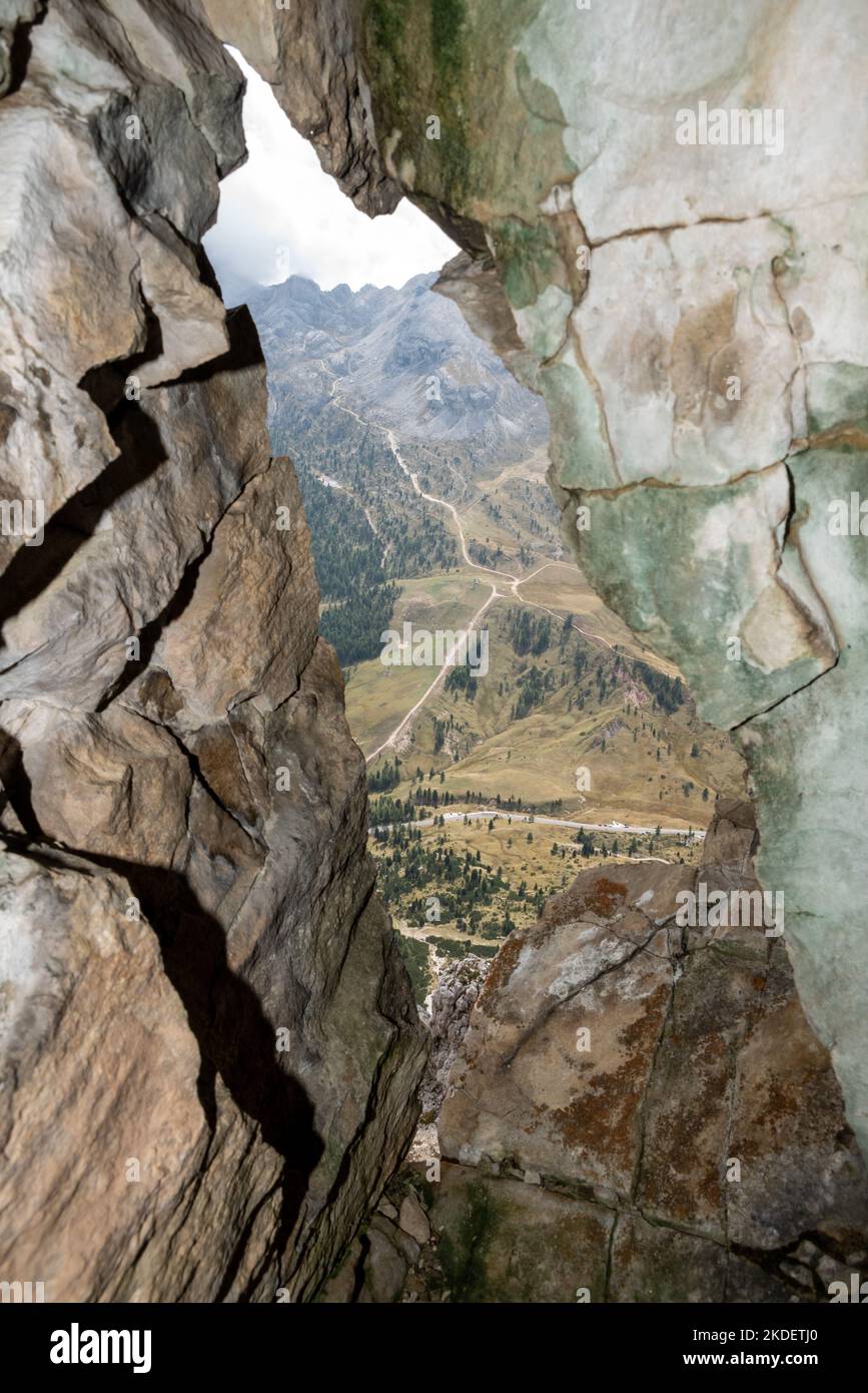 View out of a loophole of the Mount Lagazuoi tunnels, built during the First World War, the Dolomite Alps in South Tirol Stock Photo