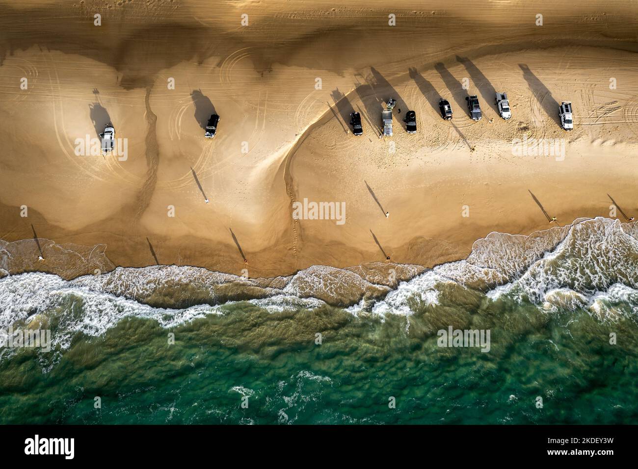 Aerial shot of fishermen and cars at Fraser Island's Seventy Five Mile Beach Stock Photo