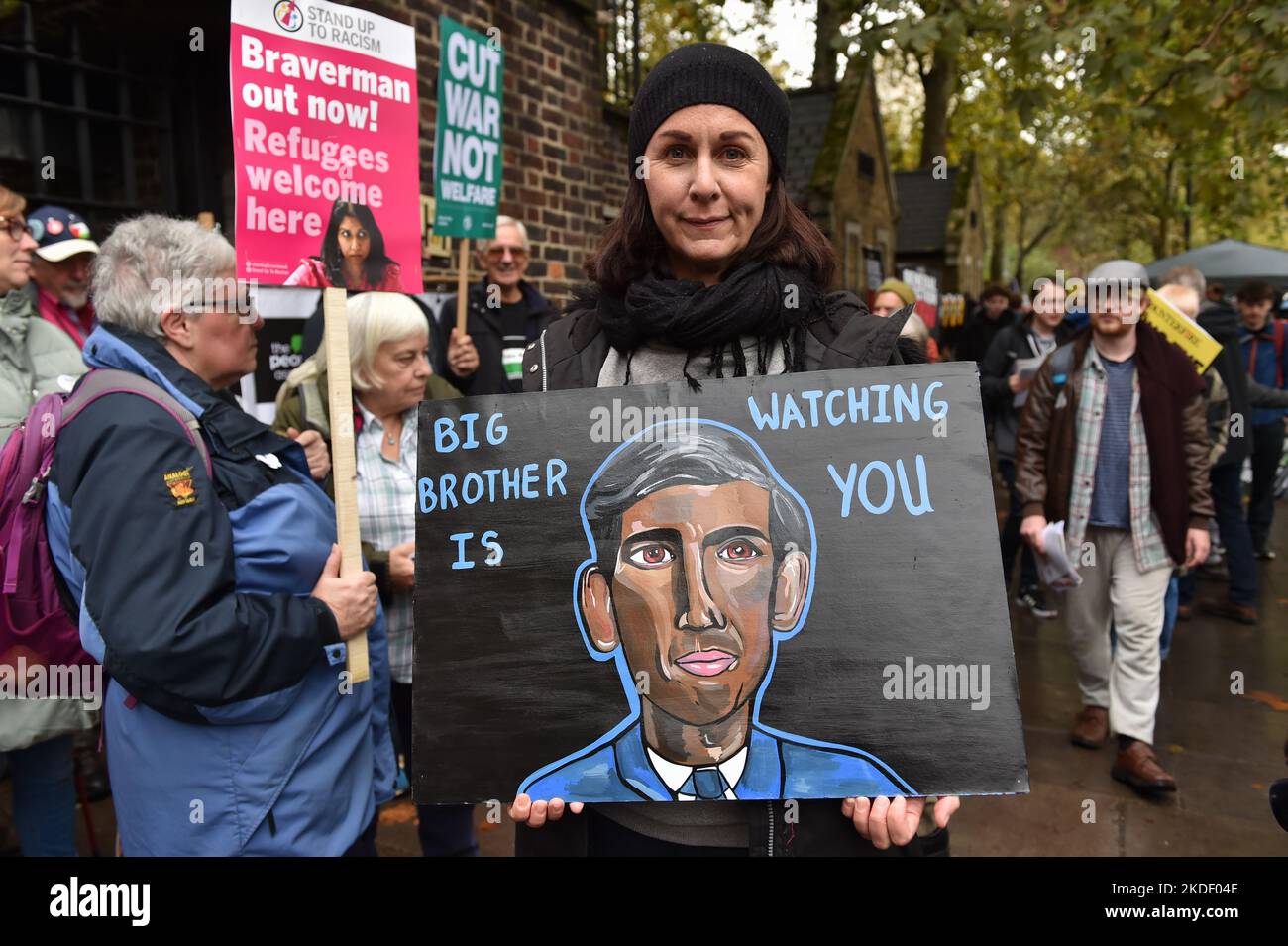 Protester holds a placard expressing her opinion at the rally. Anti government and anti-tories protesters gathered in Embankment and marched through Westminster to demand general election. Stock Photo