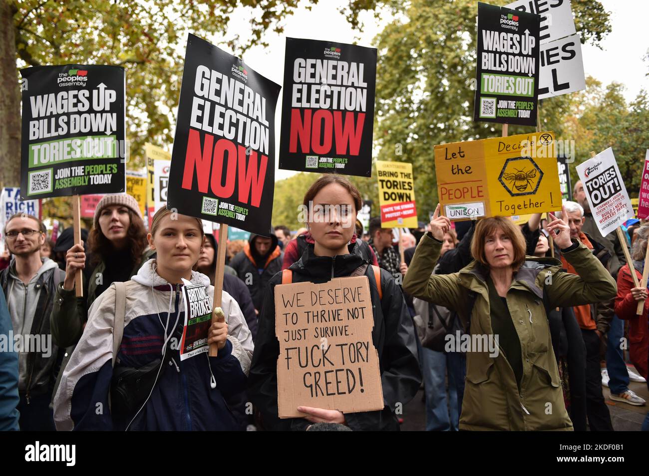 Protesters hold placards expressing their opinion during the demonstration. Anti government and anti-tories protesters gathered in Embankment and marched through Westminster to demand general election. Stock Photo