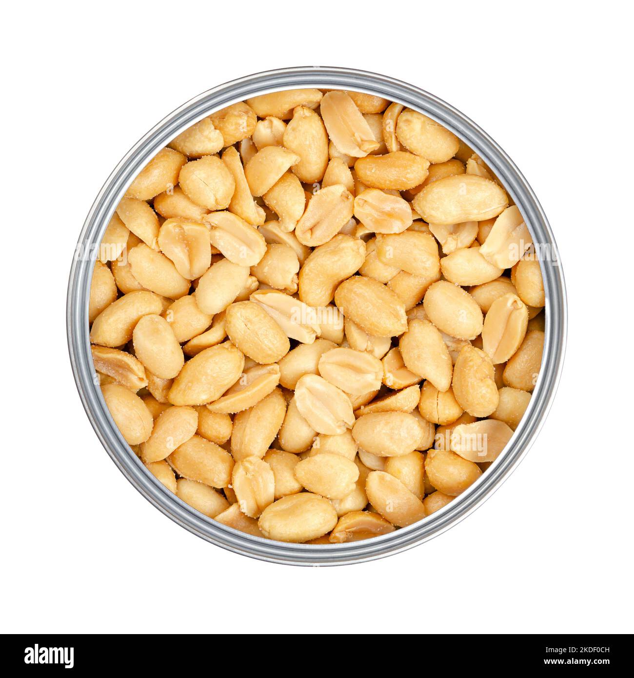 Roasted and salted peanuts in an opened tin can, close-up, from above, isolated, over white. Snack food, made from fruits of Arachis hypogaea. Stock Photo