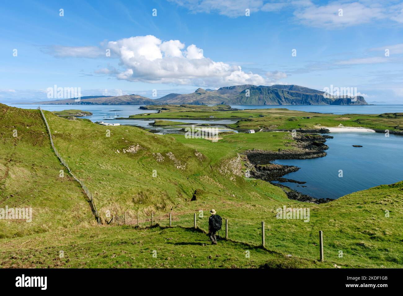 The Isle of Rum over the Isle of Sanday, from the Isle of Canna, Scotland, UK Stock Photo