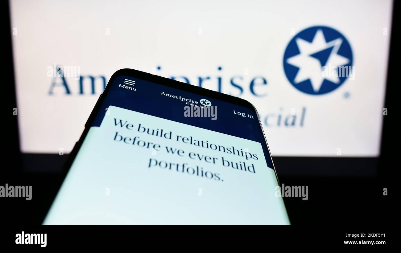 Mobile phone with webpage of US company Ameriprise Financial Inc. on screen in front of business logo. Focus on top-left of phone display. Stock Photo