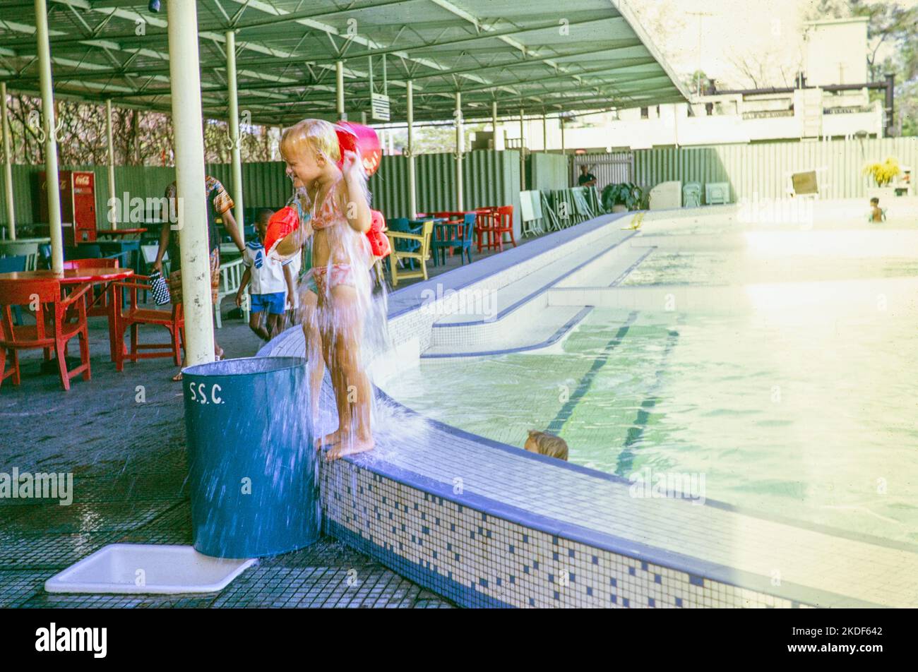 Children by swimming pool at Singapore Swimming Club, Singapore, Asia, 1971 Stock Photo