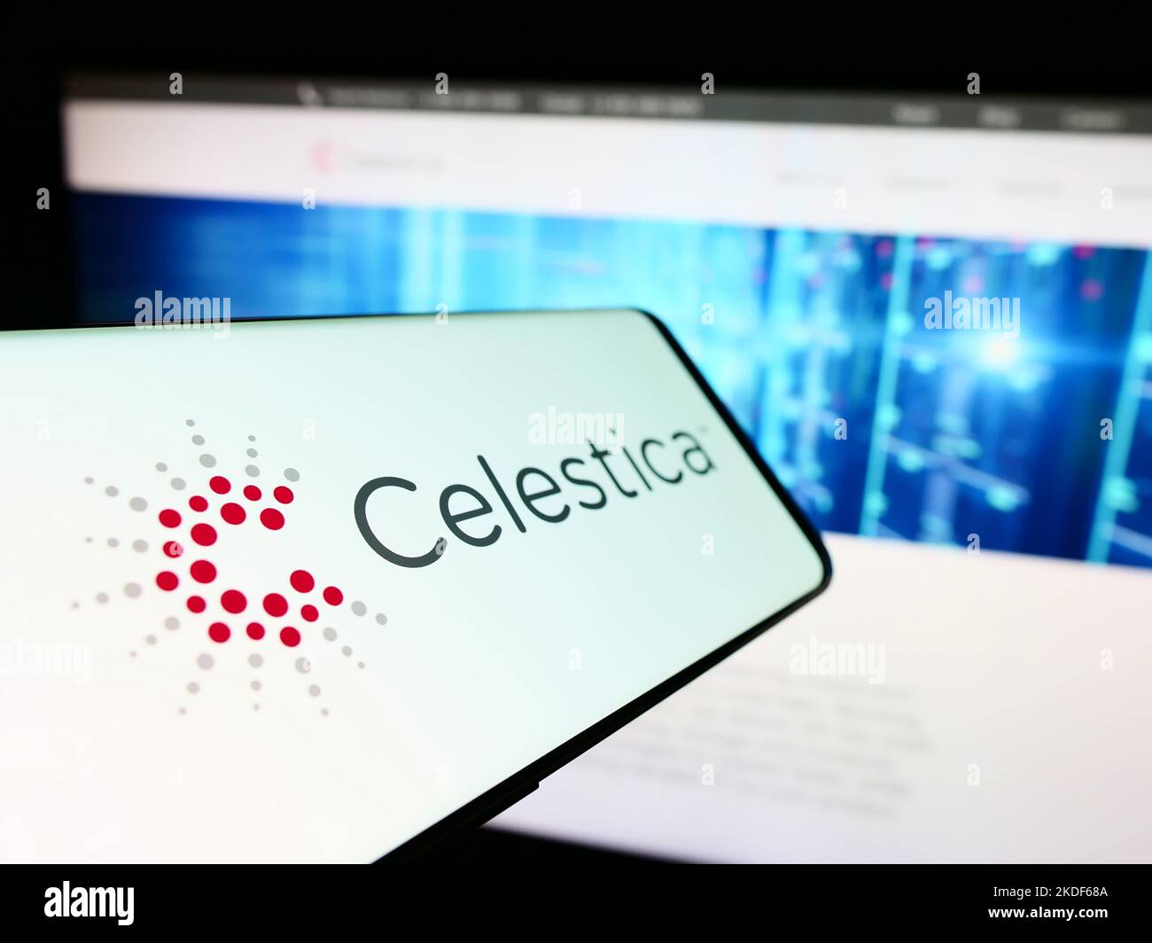 Smartphone with logo of Canadian electronics company Celestica Inc. on screen in front of business website. Focus on center-left of phone display. Stock Photo