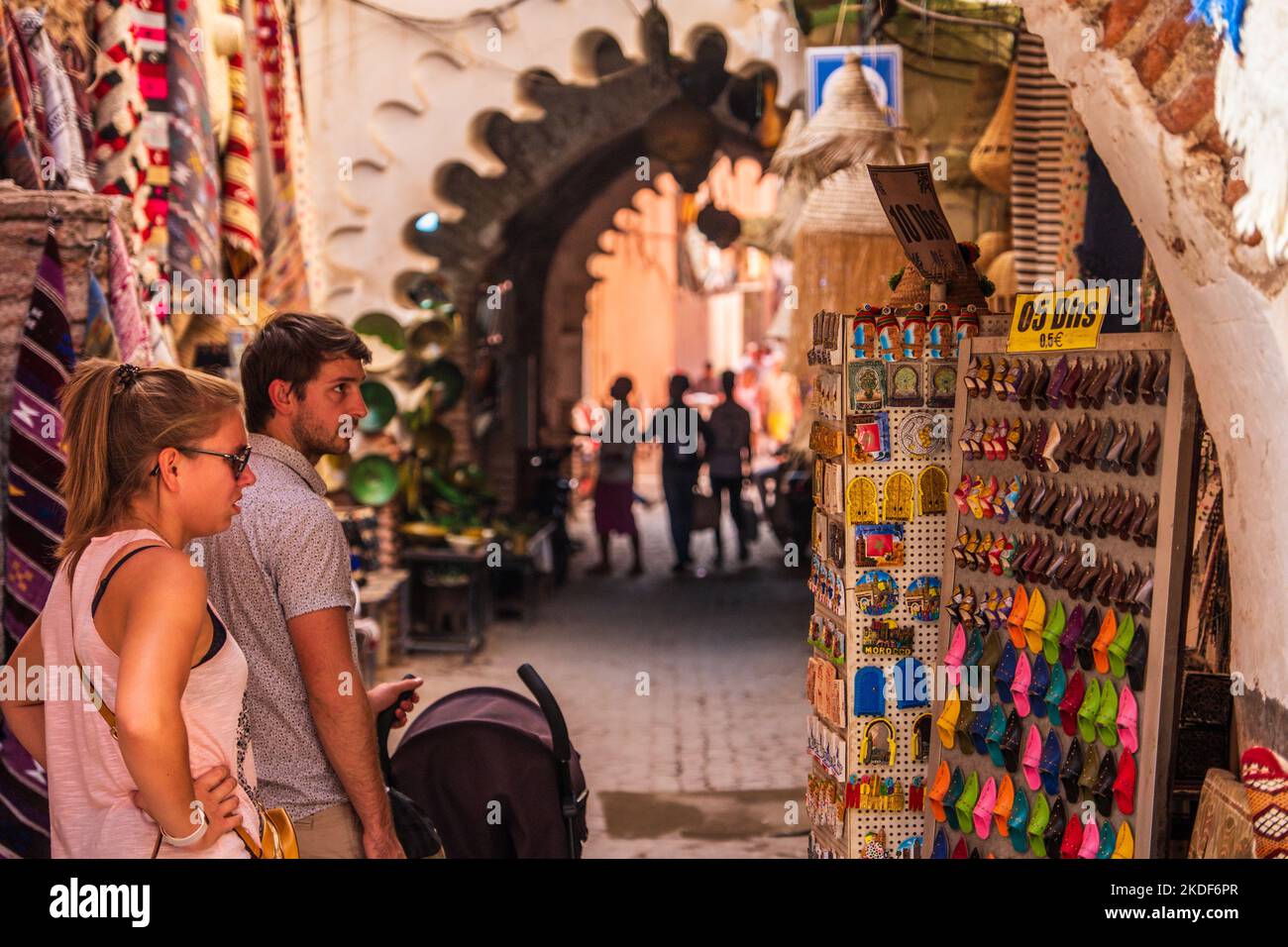 Visitors shopping for souvenirs In the souqs of the  medina ( old town) of Marrakech, Morocco Stock Photo
