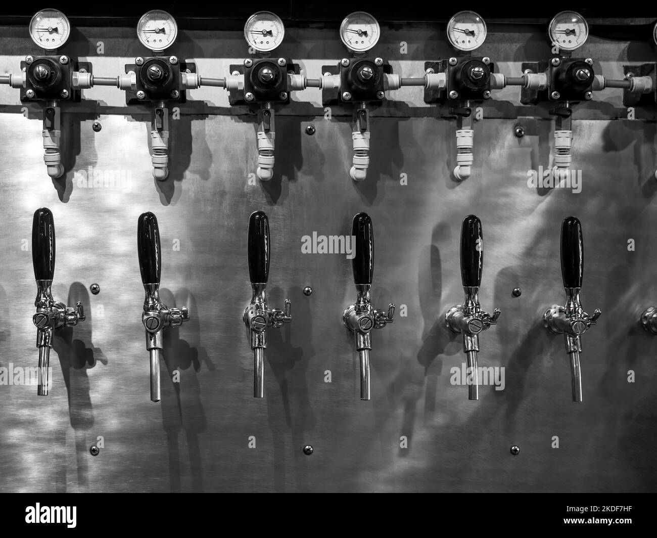 Row of beer tap lines for cold draft beer in pub and restaurant. Craft