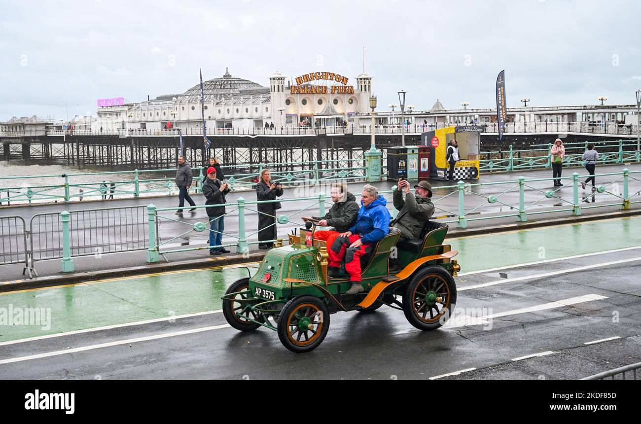 Brighton UK 6th November 2022 - Participants pass by Brighton Palace Pier as they complete the annual RM Sotheby's London to Brighton Veteran Car Run on a wet and windy day . The Run is open to four-wheeled cars, tri-cars and motor tricycles manufactured before 1st January 1905 : Credit Simon Dack / Alamy Live News Stock Photo